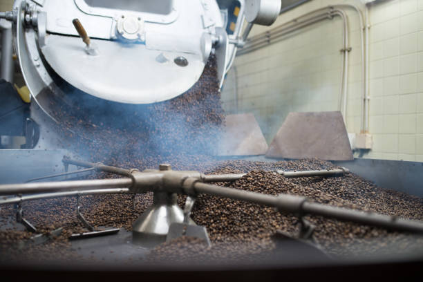 istock Close-up of coffee roasting machine at work 1341397284