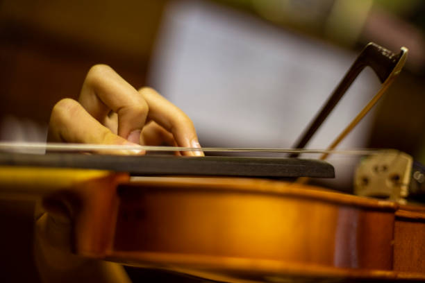 istock left hand of a young violinist presses the strings on the violin neck, horizontal 1341397788