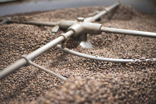 istock Close-up of roasted coffee beans in roasting machine 1341398385