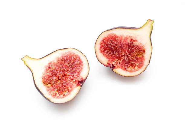 Two pieces, slices of ripple figs isolated on white, top view, space for text