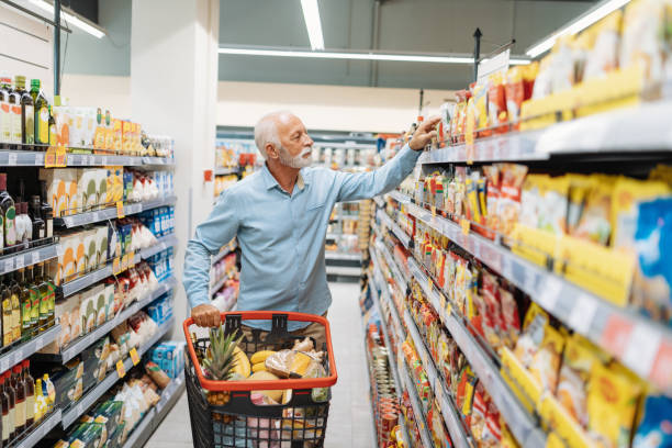 istock Retired man buying groceries 1341406148