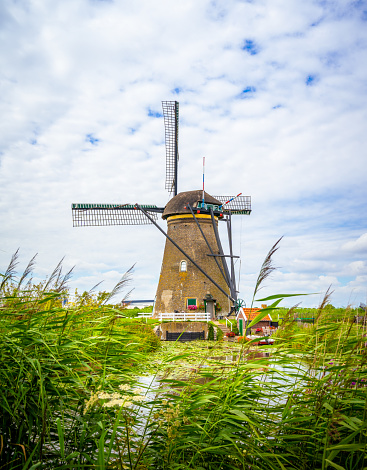 Colorful spring landscape panorama in Netherlands, Europe. Famous windmills in Kinderdijk village in Holland. Famous tourist attraction in Holland.