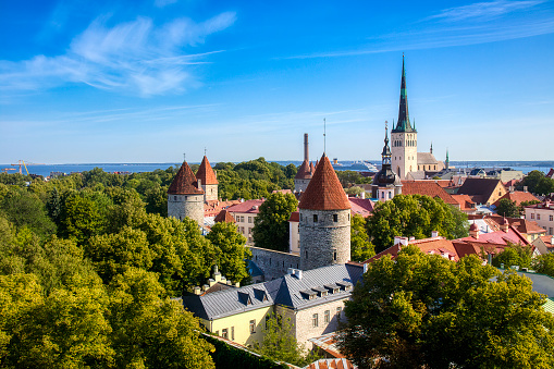 View of the Old City of Tallinn, Estonia, with City Wall Towers and St Olaf’s Church, as seen from Toompea