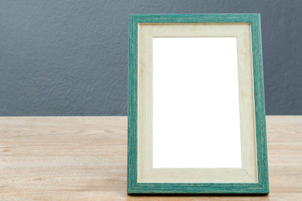 istock Picture frame wooden on table with gray wall  concrete texture background. 1341411545