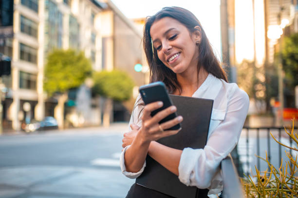 istock Gorgeous Hispanic Businesswoman Using a Smartphone 1341414658