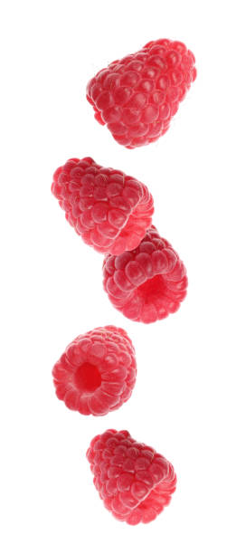 istock Set of falling sweet raspberries on white background 1341416364