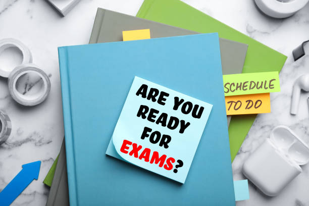 istock Reminder note with phrase ARE YOU READY FOR EXAMS and stationery on table, flat lay 1341417316