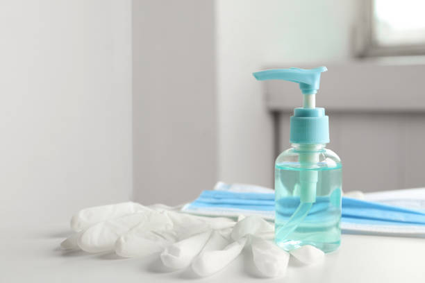 istock Antiseptic gel, protective gloves and mask on table indoors. Protection from virus 1341417841