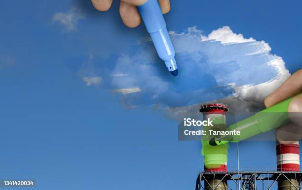 Hands Painting Blue And Green Pollution From A Chimney Stock Photo - Download Image Now