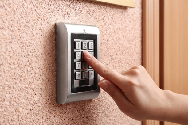 istock Woman entering code on electronic lock's keypad indoors, closeup 1341420391