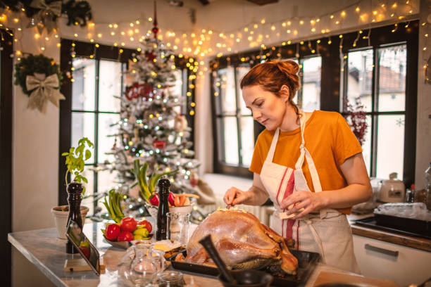 preparing stuffed turkey for holidays - christmas turkey imagens e fotografias de stock