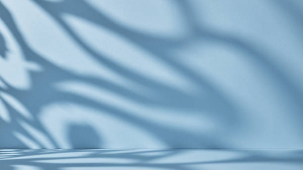 istock Backdrop for product presentation. Blue background with ornate shadows and light. 1341423816