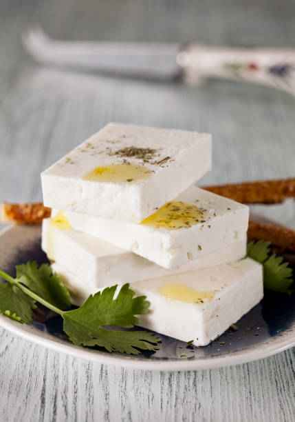 Slices of white cheese on plate