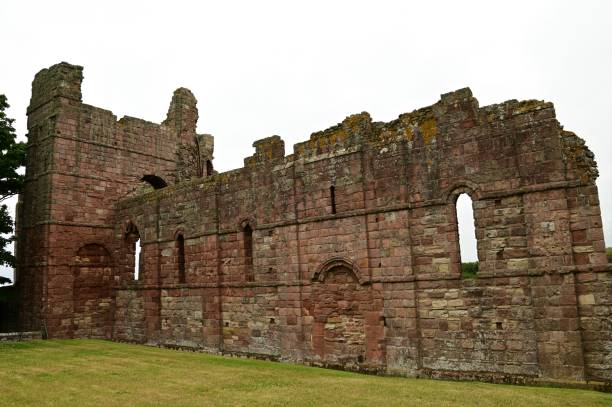 Landmarks of England - Lindisfarne An external view of the ruins of a medieval priory building on the island of Lindisfarne in Northumberland. lindisfarne monastery stock pictures, royalty-free photos & images