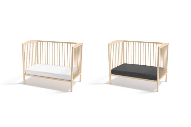 istock Blank wood cot with black and white crib sheet mockup 1341425613