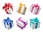 Set of white color gift boxes with colorful ribbon