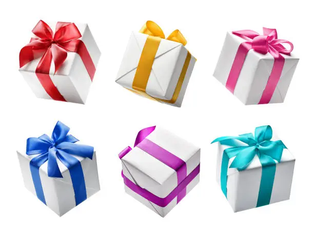 Photo of Set of white color gift boxes with colorful ribbon