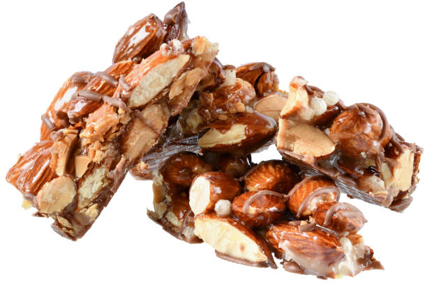 istock Chocolate bar with caramel, almonds and puffed rice isolated 1341427895