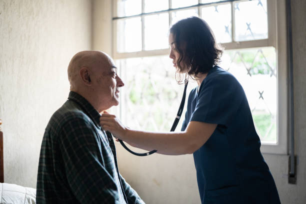 istock Doctor examining a senior patient at home 1341430607