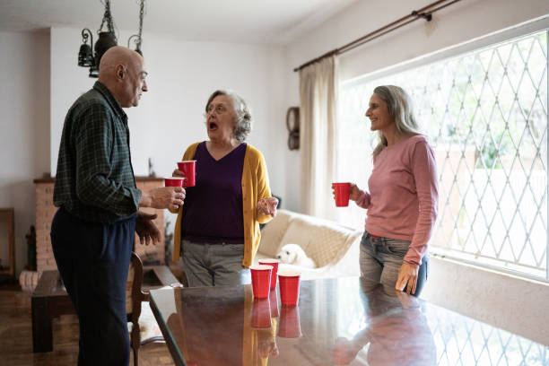 istock Friends drinking at a party at home 1341430613