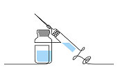istock Syringe with bottle of drug 1341430911