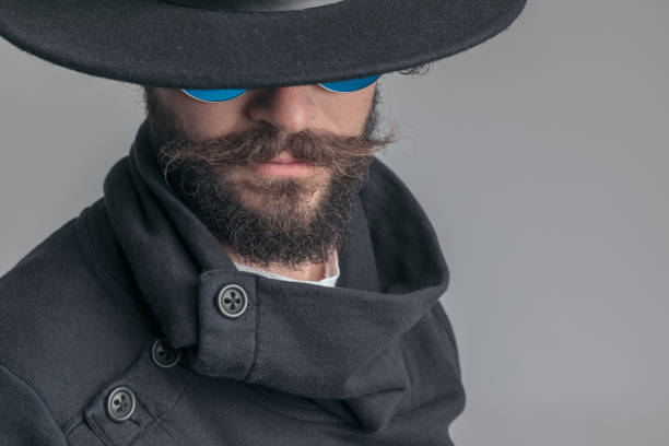 istock mysterious casual man wearing sunglasses and hiding his face 1341432380