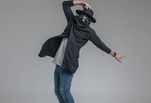 istock fashion model hiding his face in his cardigan's collar 1341432536