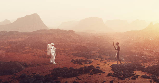 Astronaut meeting an alien on planet such as Mars stock photo