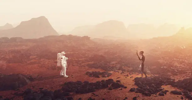 Photo of Astronaut meeting an alien on planet such as Mars