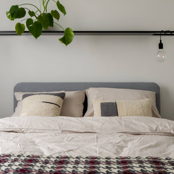 istock Comfortable bed with stylish bedclothes, close-up 1341434114