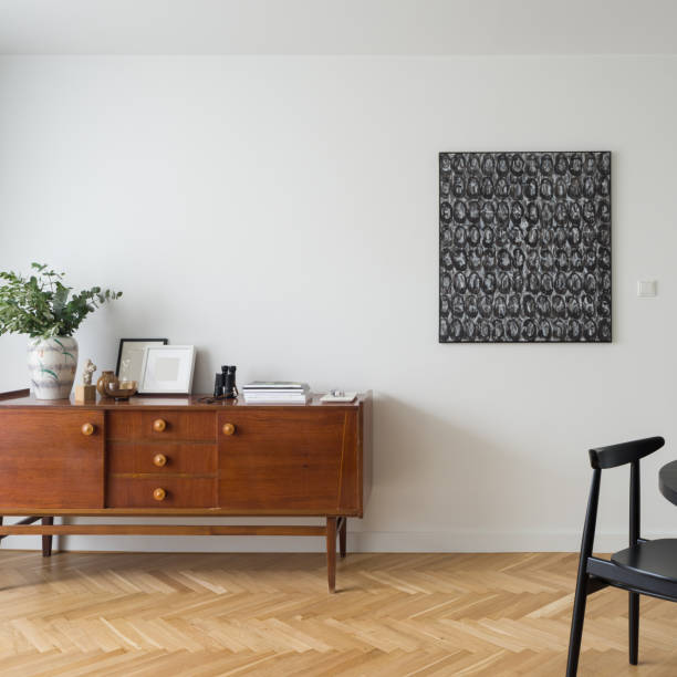 istock Spacious room with vintage sideboard with decorations 1341434122
