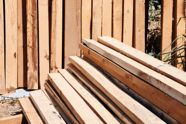 istock Stack of sawed wooden planks or timber at a construction site. 1341435272