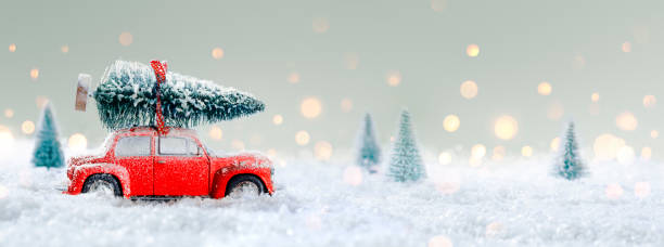 istock Deformed And Unrecognizable Car Carrying A Christmas Tree In Snowy Landscape 1341436404