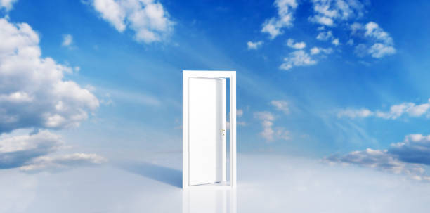 istock Open door to blue sky. Hope, new life, change concept. 1341436414