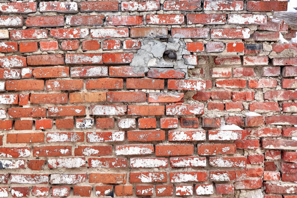 istock Background of old vintage dirty brick wall with peeling plaster, texture 1341438217