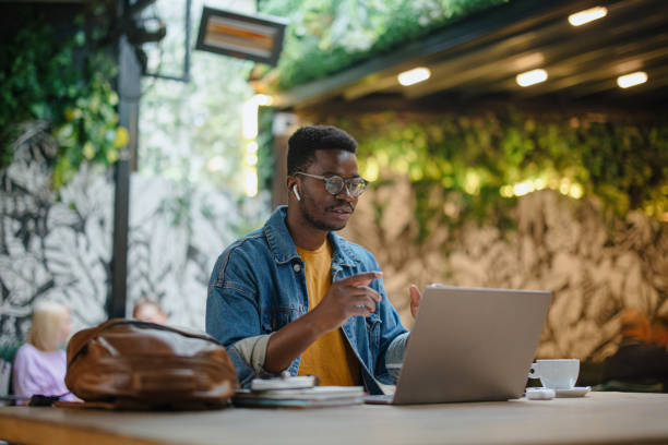 istock Young man teaches online. Online tutoring via video call 1341438907