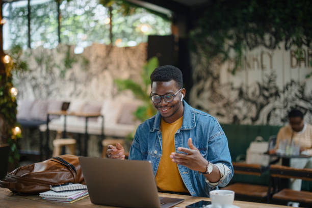 istock Young man teaches online. Online tutoring via video call 1341438947