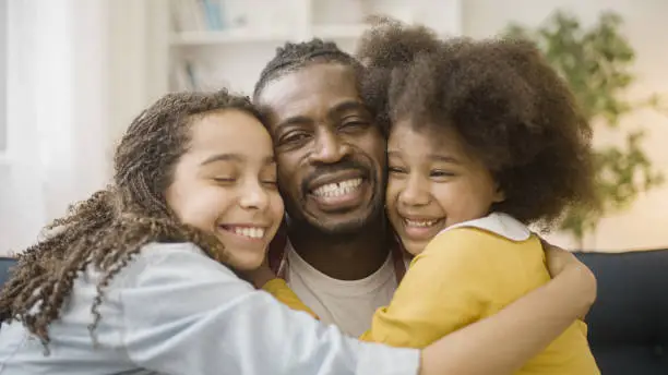 Happy black family of father and two daughters smiling on camera, support, care