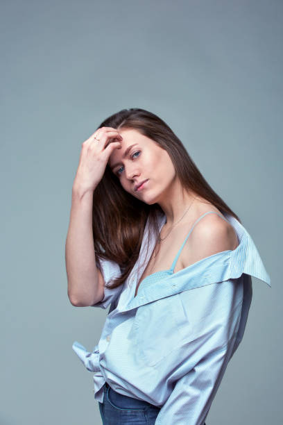 istock beautiful girl with blue eyes posing over gray background 1341440141