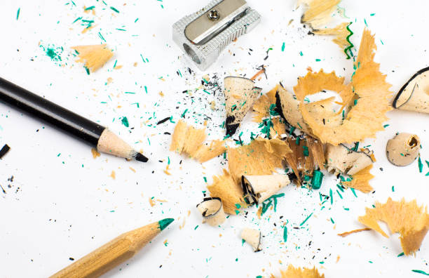 istock Sharpener and a broken pencil. Shavings and a graphite on white background. Close up, Macro photo. Back to school concept. 1341442898