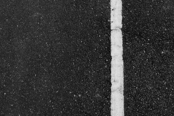 istock The white line on the right and the black road 1341444874