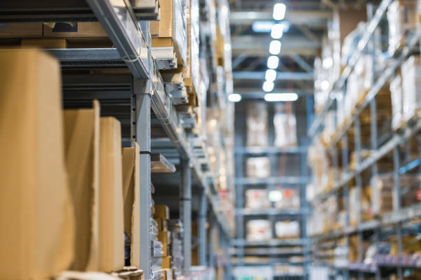 istock Modern warehouse with goods on collapsible metal shelves. 1341445048