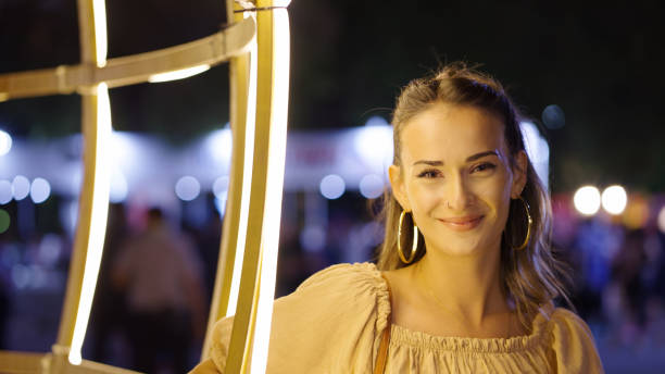 istock Cheerful young woman looking at camera 1341446456