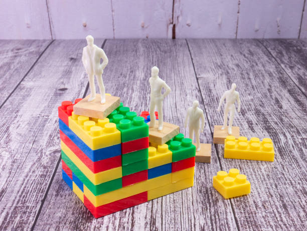 istock business figure and puzzle block multicolour  for strategy concept 1341447834