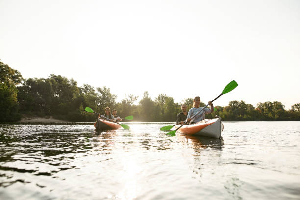 istock Restless young people kayaking together on a river, spending weekend outdoors on a summer day 1341449604
