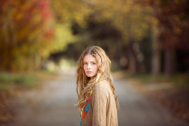 11 years old girl's portraits with autumnal colors stock photo