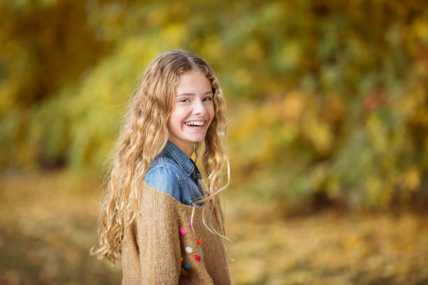 Beautiful teenager girl surrounded by autumnal colors - Autumn - Argentina - Latin American - Caucasian