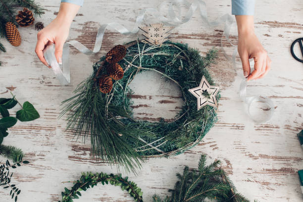 istock Woman Making A Christmas Wreath 1341451317