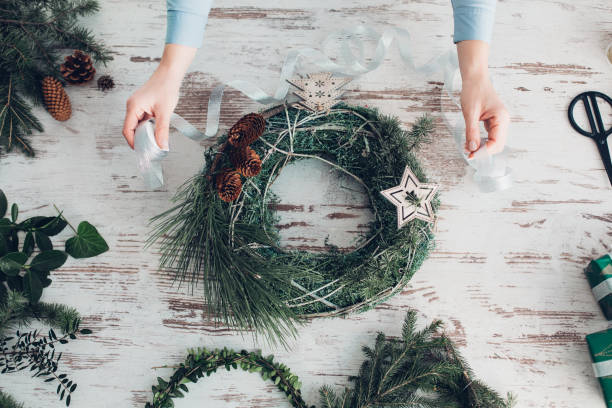 istock Woman Making A Christmas Wreath 1341451892