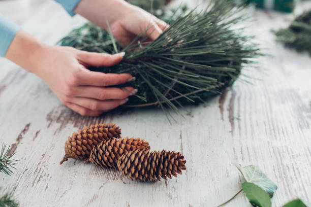 istock Woman Making A Christmas Wreath 1341452079